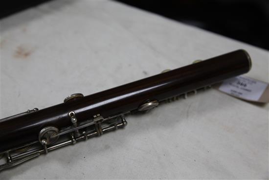 A Rudall Carte & Co. rosewood flute, no. 7340, flute 26.5in.